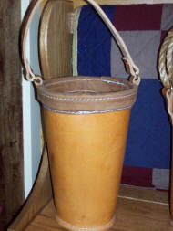 large leather fire bucket fire gear repair inspection and cleaning